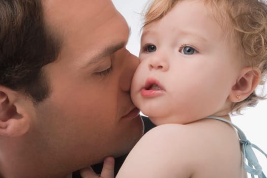 Close_up of a young man loving his daughter