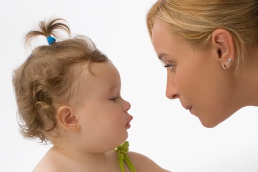 Close_up of a mid adult woman looking at her daughter