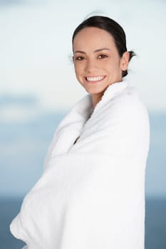 Portrait of a young woman wrapped in a towel