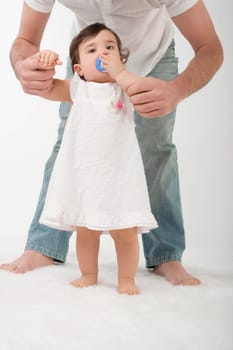 Portrait of a girl sucking a pacifier