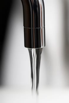 Water flowing out of a faucet