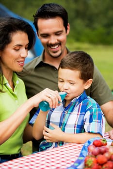 Mother feeding her son with a bottle