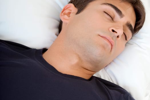 Close-up of a mid adult man sleeping
