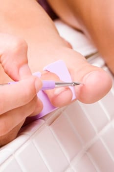Close-up of a womanŽs hand using a nail file