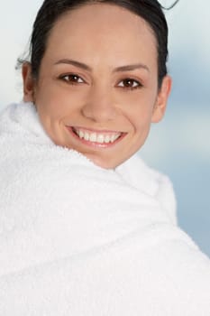 Portrait of a young woman wrapped in a towel