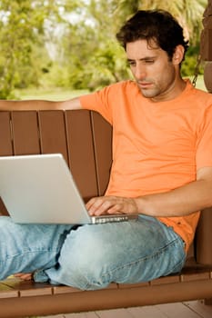 Close-up of a mid adult man using a laptop