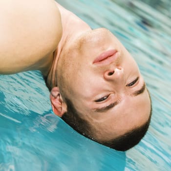 Close-up of a young man in a swimming pool