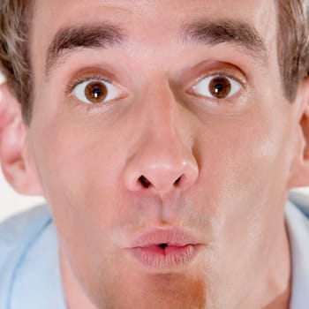 Portrait of a mid adult man looking surprised