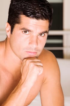 Portrait of a mid adult man with his hand on his chin