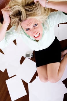 High angle view of a mid adult woman with her hands in her hair