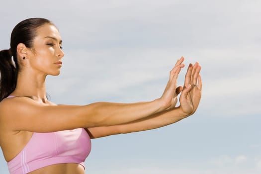 Side profile of a mid adult woman exercising