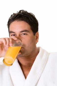 Portrait of a mid adult man drinking a glass of juice
