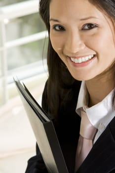 Portrait of a businesswoman holding a file