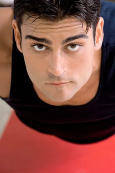 Portrait of a mid adult man doing push-ups