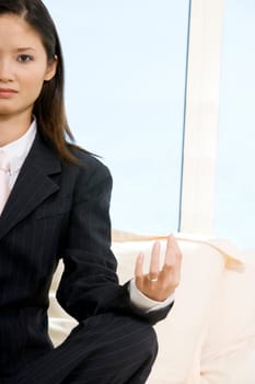 Portrait of a businesswoman sitting in the lotus position