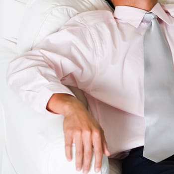 High angle view of a businessman sleeping in an armchair