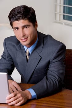 Portrait of a businessman using a laptop
