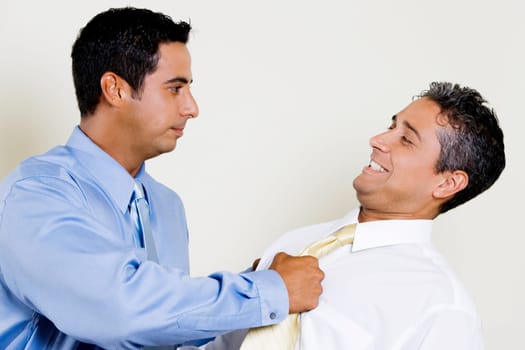 Businessman pulling his ColleagueŽs tie