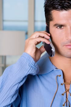 Portrait of a young man talking on a mobile phone