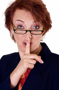 Portrait of a businesswoman with her finger on her lips
