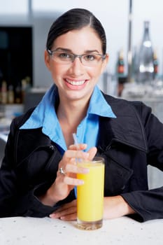Portrait of a businesswoman with a glass of orange juice