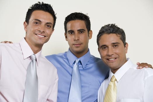 Portrait of three businessmen smiling