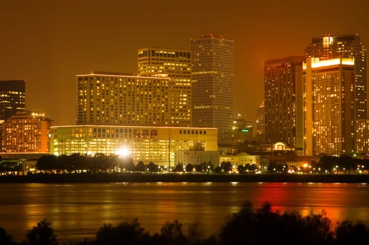 Buildings in a city lit up at night, New Orleans, Louisiana, USA