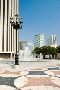 Lamppost and fountain in front of a building, New Orleans, Louisiana, USA