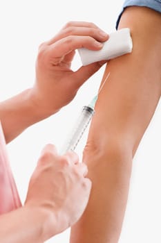 Close_up of a doctor giving injection to a patient