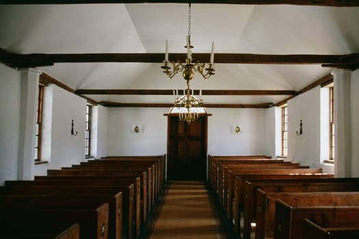 Front view of an elegant chandelier above the aisle, Old devonshire church, Bermuda