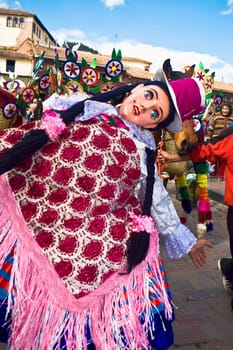 Close-up of a woman wearing a traditional costume and dancing, Peru