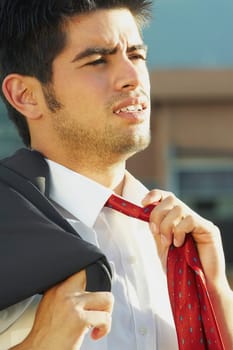 Businessman adjusting his tie