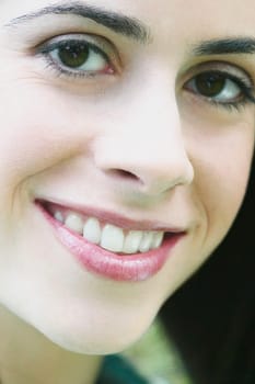 Close_up of a young woman wearing flowers