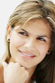 Close_up of a young woman smiling and looking away