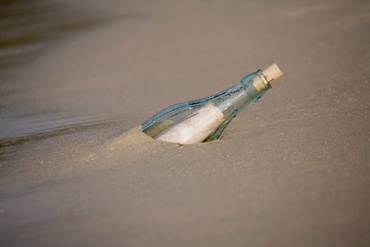 High angle view of a bottle on the beach
