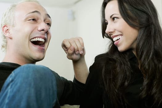 Close_up of a young couple smiling