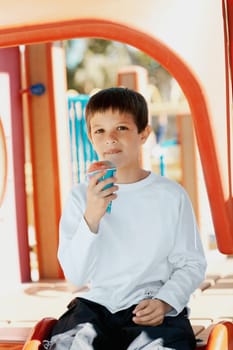 Portrait of a boy holding an ice_cream cone