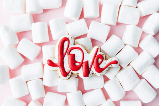 Gingerbread cookies love with white marshmallow. Valentine card. Pink background. High quality photo