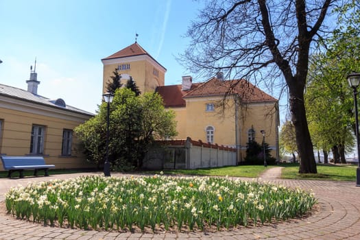 VENTSPILS, LATVIA - APRIL 04, 2019: The Castle of the Livonian order, which houses Ventspils Museum since September 2001, is the oldest preserved building in Ventspils, Latvia