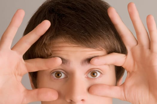 Close_up of a young man staring