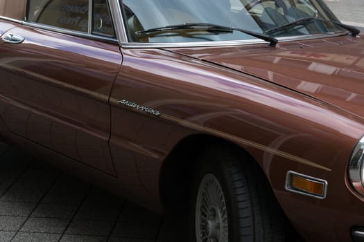 HEILIGENHAUS, NRW, GERMANY - SEPTEMBER 10, 2017:..Alfa Romeo Spider Side view in dark red color, parked in Heiligenhaus, Deutschland.