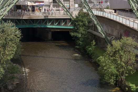 WUPPERTAL  NRW  GERMANY - JULY 31  2017:...The supporting framework of the Wuppertaler suspension railway consists of a steel framework with inclined supports and suspended steel bridges so-called Rieppelträger.