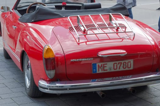 HEILIGENHAUS, NRW, GERMANY - SEPTEMBER 10, 2017:..Vintage Volkswagen Karmann Ghia car rear view in red, parked in Heiligenhaus, Germany.