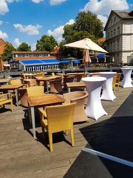 LÜNEBURG, NIEDERSACHSEN, GERMANY - JULI 27, 2018:.Restaurant Terrace in the center of the city Lüneburg in the background you can see the Romantik Hotel Bergström in the historic center of Lüneburg.