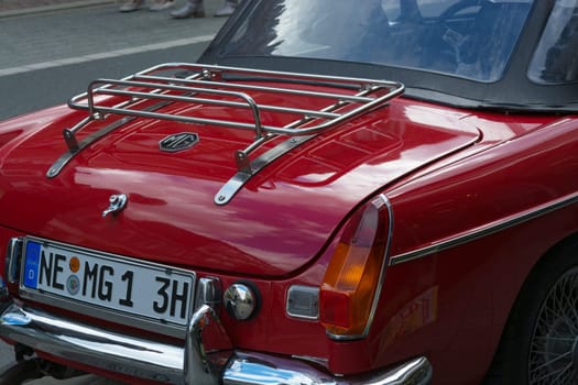 HEILIGENHAUS, NRW, GERMANY - SEPTEMBER 10, 2017:..Vintage car Morris Garages model MGB rear view in red color, parked in Heiligenhaus, Germany.