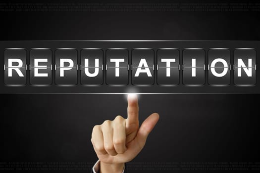 business hand pushing reputation on Flipboard Display