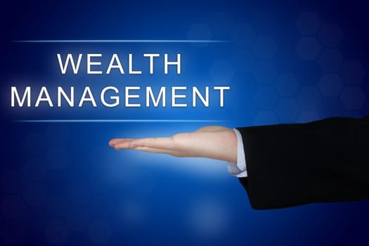 wealth management button with business hand on blue background