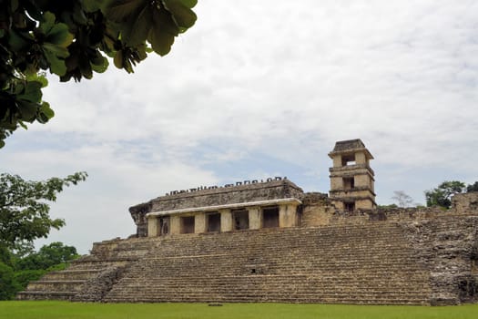 The palace with its tower in ruins at ancient Mayan city of Palenque in Mexico