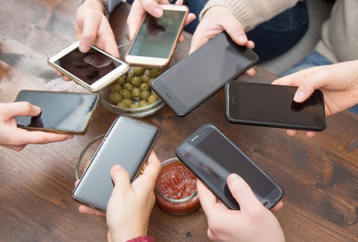 Top view hands circle using phone in cafe