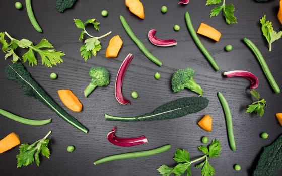 top view of various and colorful vegetables isolated on black background